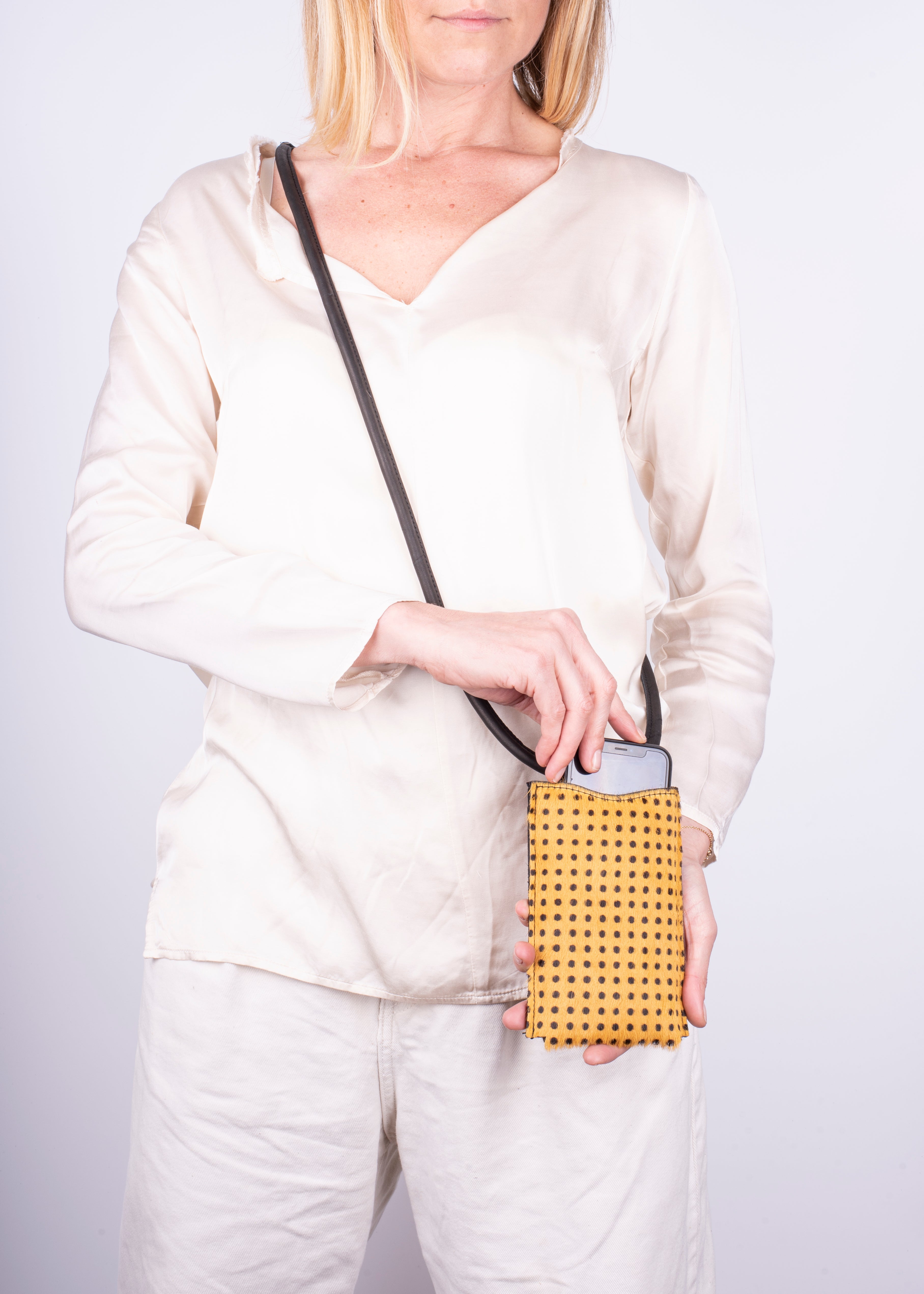 Ilde yellow pony with small polka dots - mobile phone holder in yellow pony with polka dots