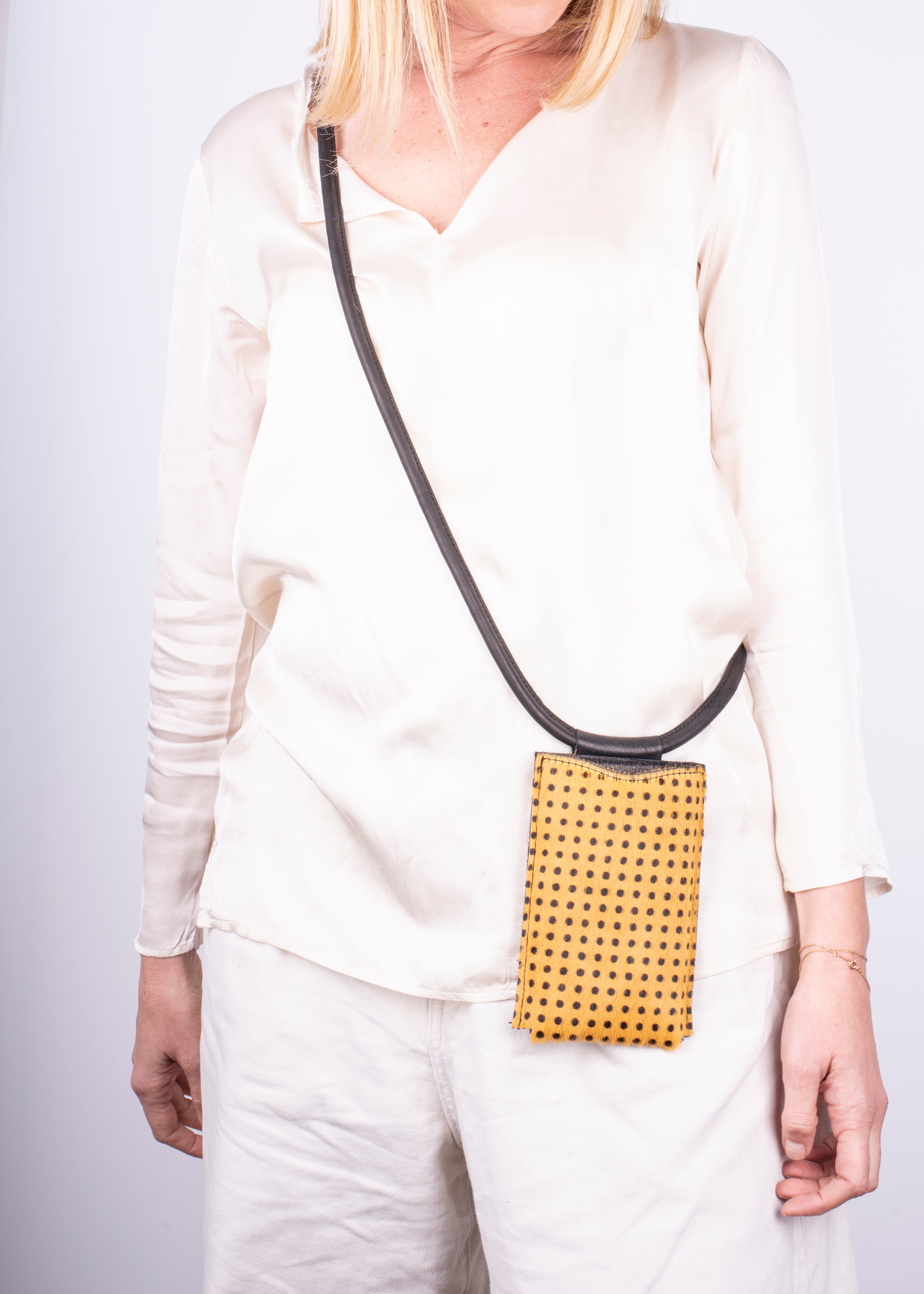 Ilde yellow pony with small polka dots - mobile phone holder in yellow pony with polka dots